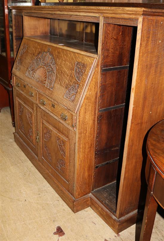 Large Edwardian carved oak bureau combined open fronted bookcase, 6ft